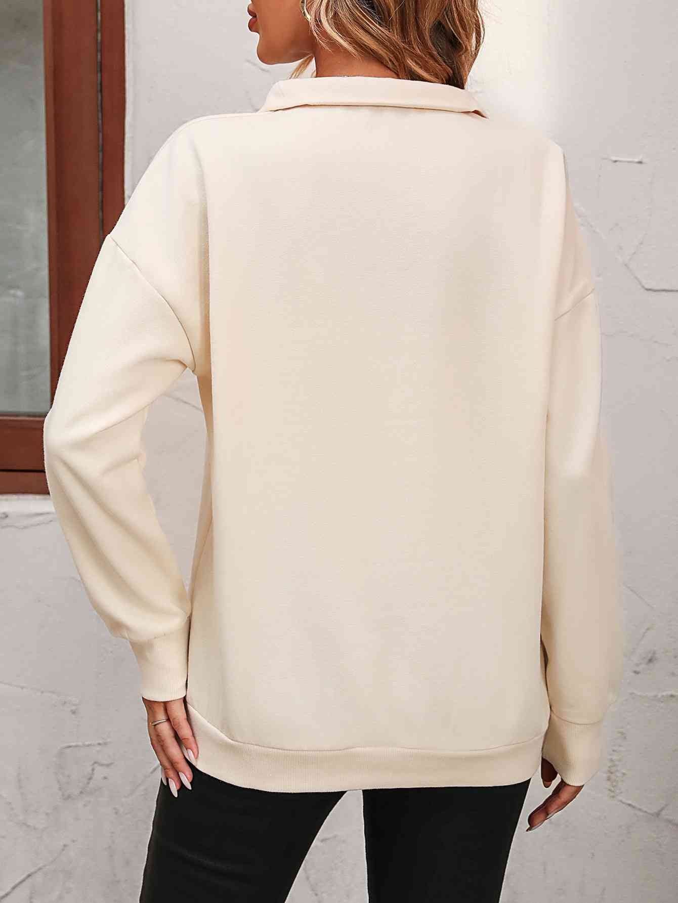 Sudadera con cremallera y hombros caídos