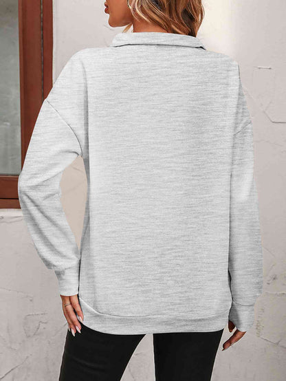 Sudadera con cremallera y hombros caídos
