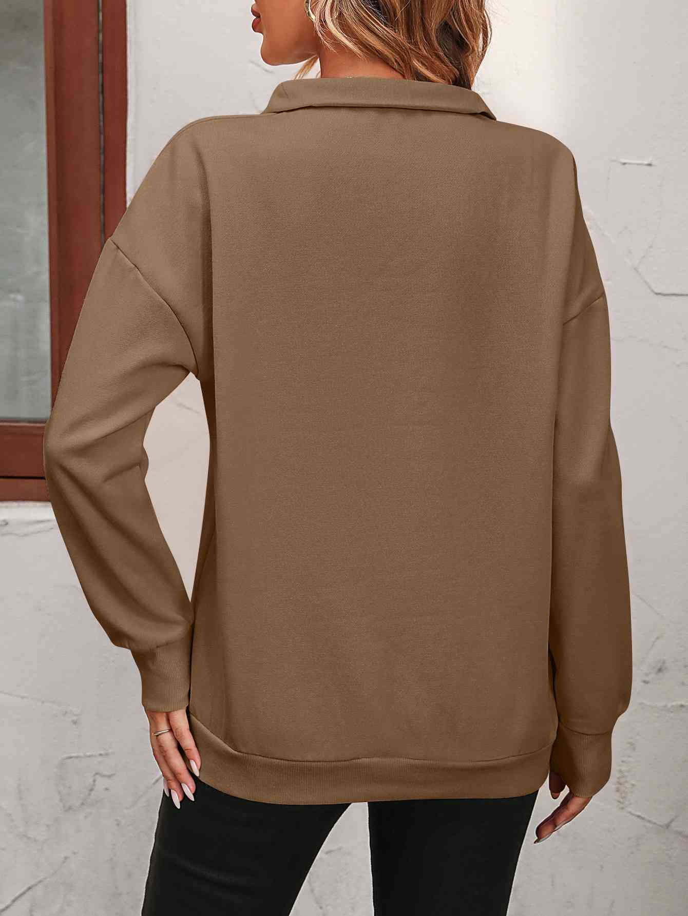 Sudadera con cremallera y hombros caídos