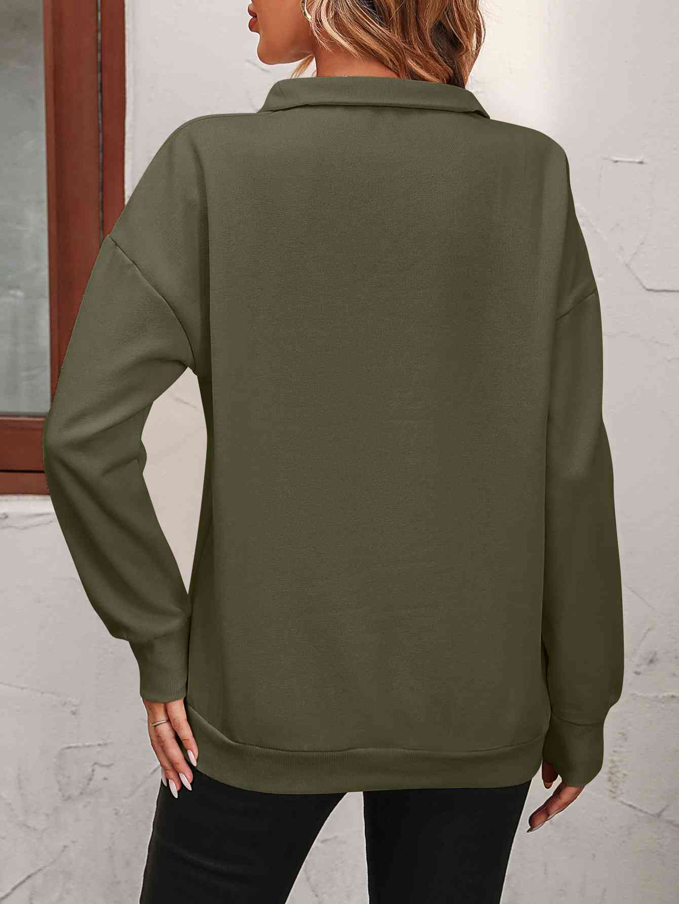 Sudadera con cremallera y hombros caídos