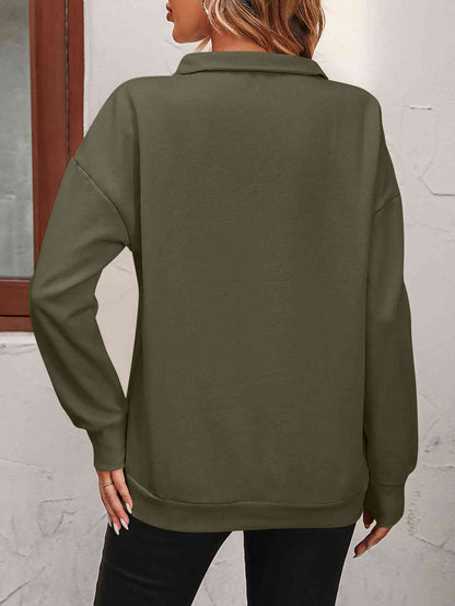 Sudadera con cremallera y hombros caídos