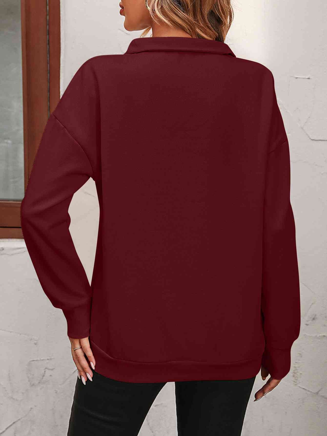 Sudadera con cremallera y hombros caídos